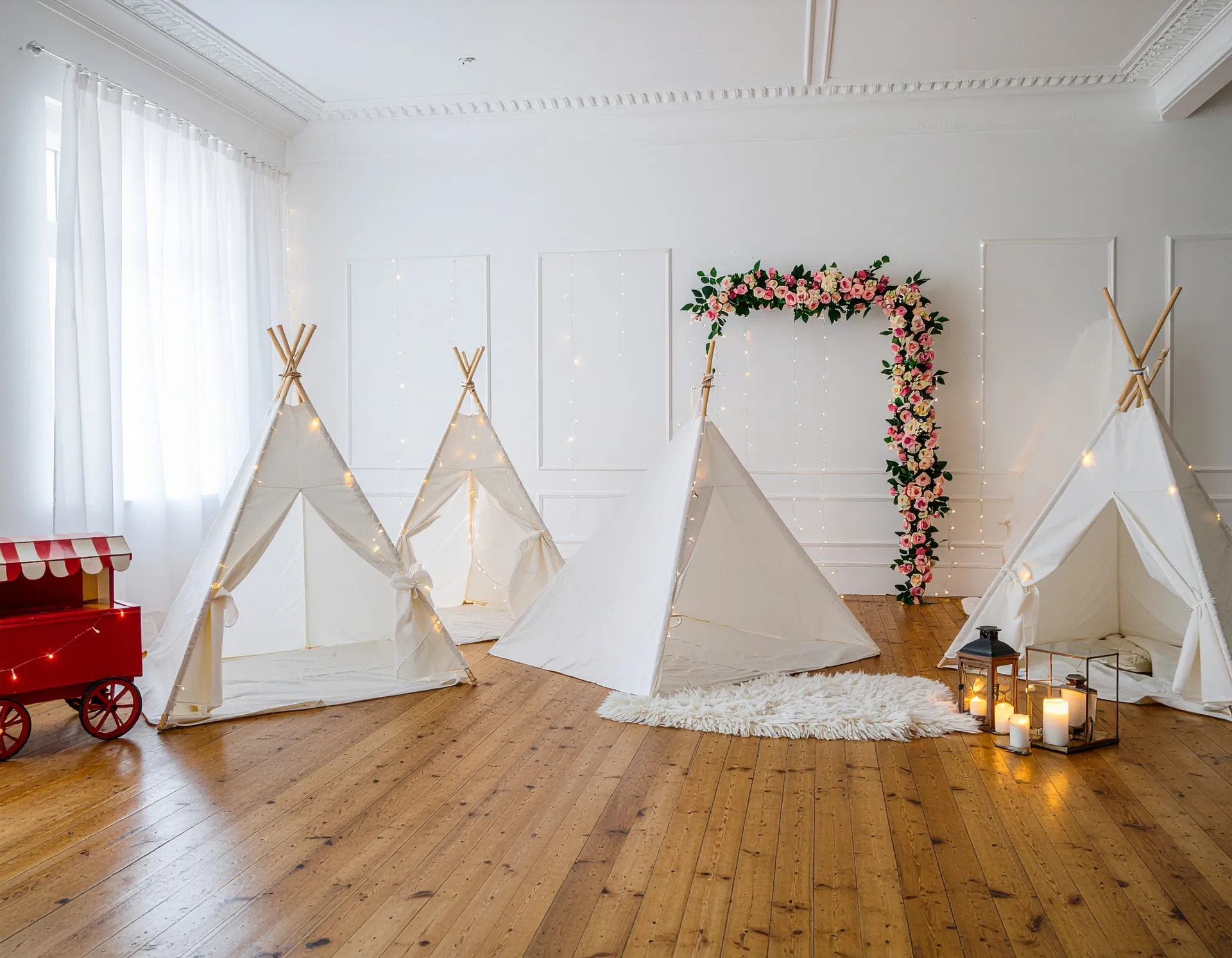 Single white lace teepee tent with dreamcatcher, pink pillows, and styled breakfast tray