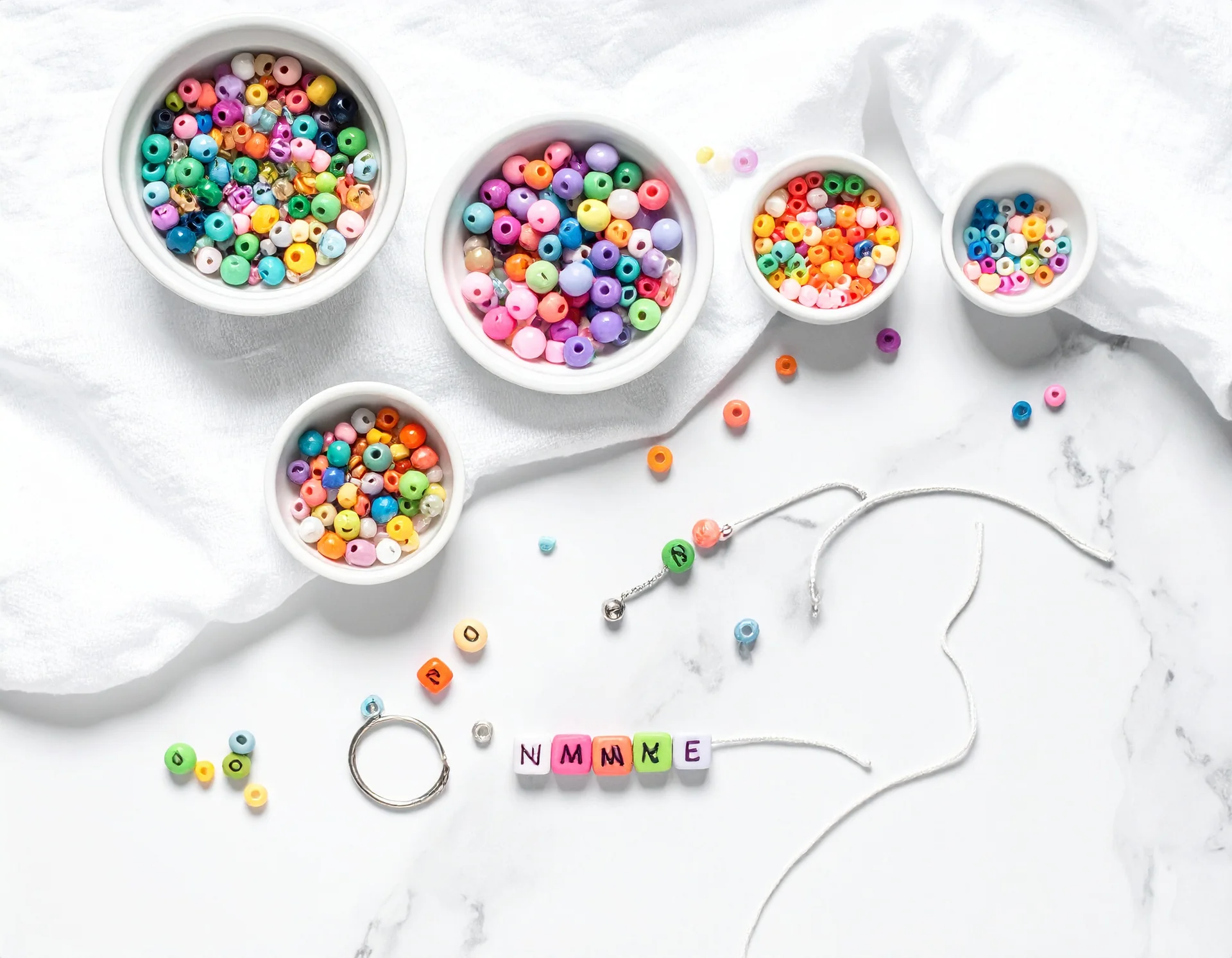Bead keychains and craft supplies laid out for the DIY Craft Bar activity